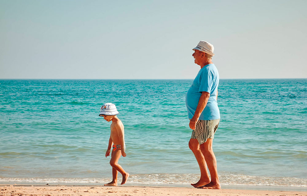 A person standing on a beach

Description automatically generated